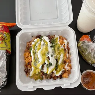 left to right - hot cheeto burrito, burrito bowl with carnitas, horchata