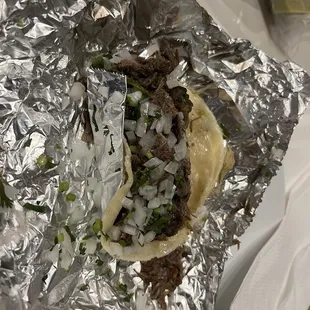 a taco wrapped in foil