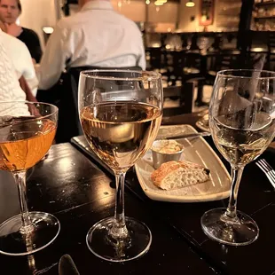 three glasses of wine on a table