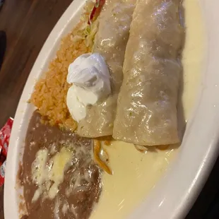 Enchiladas pollo a la crema. There crema is a spicy jalepeno crema. Very good.