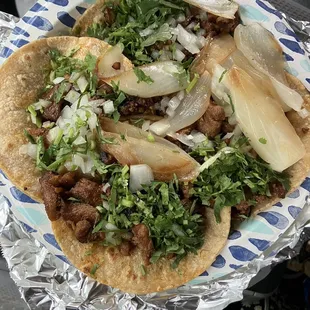 Tacos de carne asada with freshly made corn tortillas. Yummmmm
