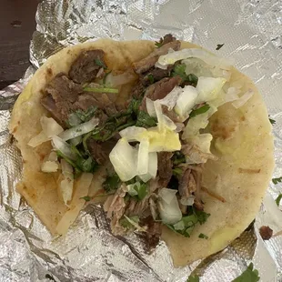 Bitten carnitas taco