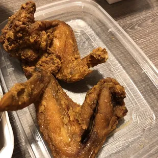fried chicken in a plastic container