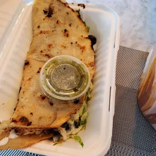 Quesadilla de huitlacoche Quesadilla stuffed with Huitlacoche, pronounced weet-la-COH-cheh, is a fungus that grows on ears of corn