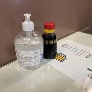 Table condiments include a delicious array of soy sauce and hand sanitizer