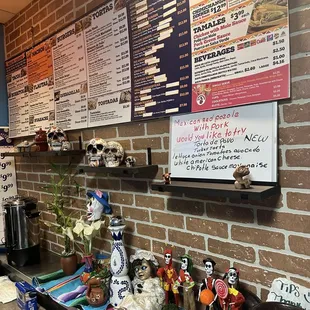 menus on a brick wall