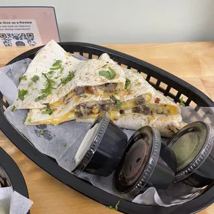 a plate of quesadillas and a cup of coffee