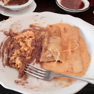 Beef and cheese enchiladas with refried beans
