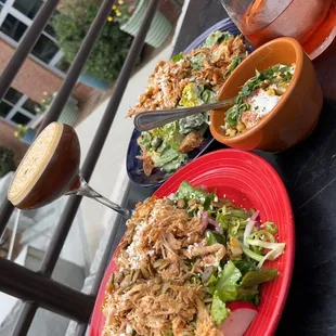 House and Cesar salad with chicken and street corn