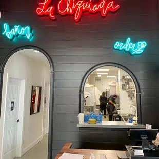 The ordering counter with beautiful custom neon signage