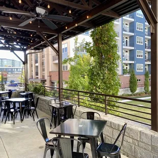 Another angle of the wraparound, covered patio and landscaping