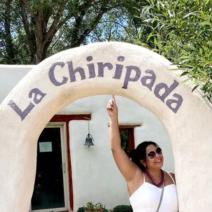 a woman standing in front of the entrance