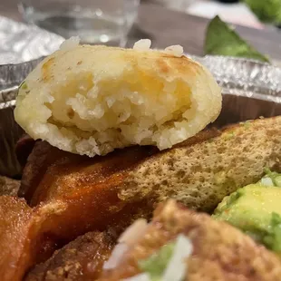Hard/dry corn cake in the Bandeja Paisa (grilled steak, pork skin, egg, sausage, corn cake, sweet plantain and avocado) for $17