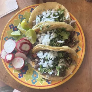 2 carne asada tacos and 1 langue