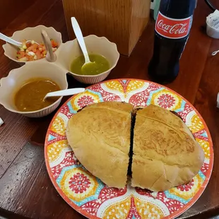 a plate with a sandwich cut in half