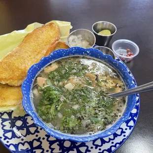 White menudo with cilantro, onions and chile chepin.