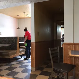 a woman cleaning a restaurant