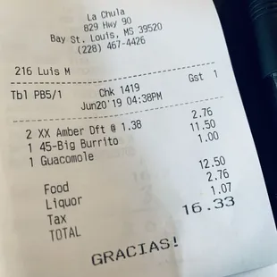 The check and half the burrito in a Togo box