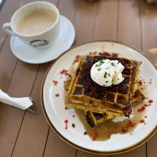 Pumpkin waffle with chorizo, poached egg, and spiced maple  insaneeee