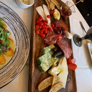 Charcuterie Board. We stater eating before taking the picture. Everything on this board was high quality. Excellent!