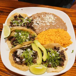 a plate of tacos and rice