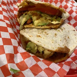 Adobaba Gordita with avocado, beans, cheese, tomato