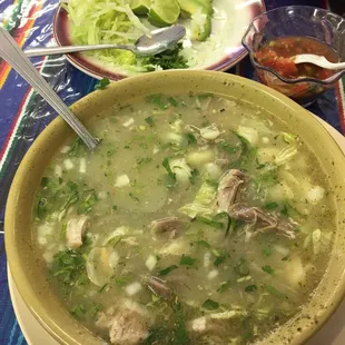a bowl of soup with meat and vegetables