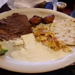 Breakfast, Salvadoran- style (served all day!): scrambled eggs, fried plantains, homemade tortilla, etc