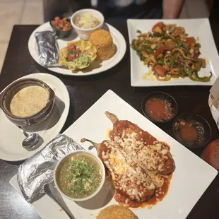 Chicken Fajita&apos;s served with a platter of shells, rice, beans and condiments to build your own tacos!