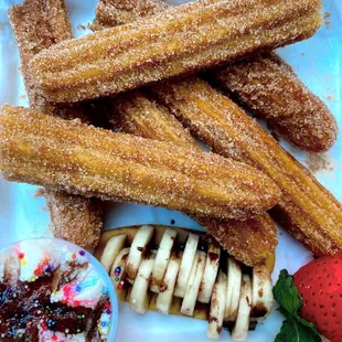 Fresh Churros! They come with caramel, chocolate, + whipped cream.