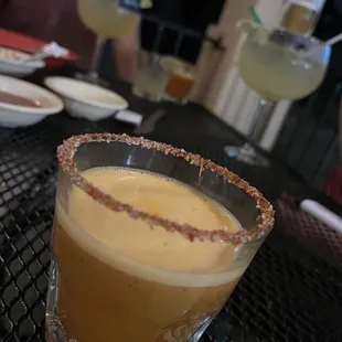 Bartenders treat of fresh squeeze orange juice, tajin and hot sauce