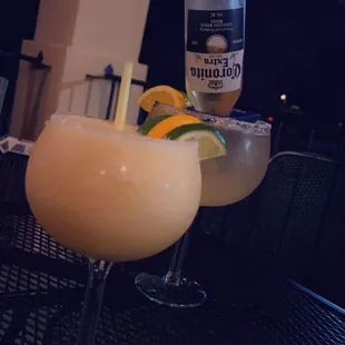 Peach blended margarita with a corona Rita in background