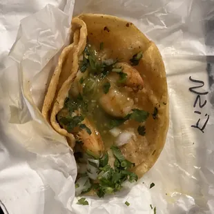 Shrimp taco with onion and cilantro