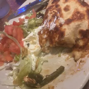 Half eaten quesadilla la cocina...delicious and one is plenty of food!