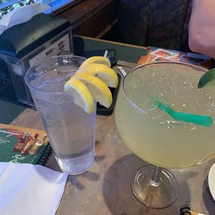 Margarita and water with a lot of lemons