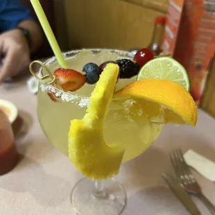 a margarita with fruit garnish