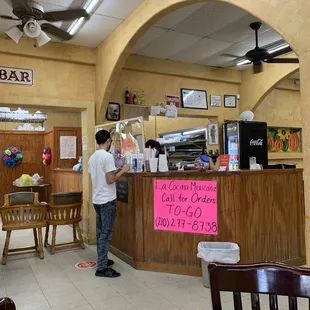a man standing at the counter