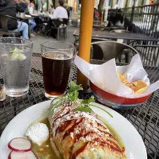 A Wet Burrito with chicken and salsa verde, massive, tasty and filling to enjoy on the patio.