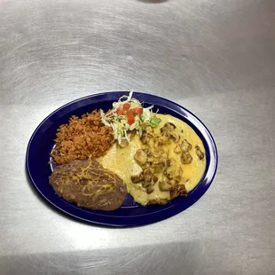 Green enchilada plate w/chicharrone