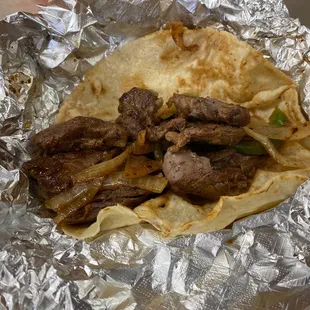 Beef fajita taco on corn tortilla