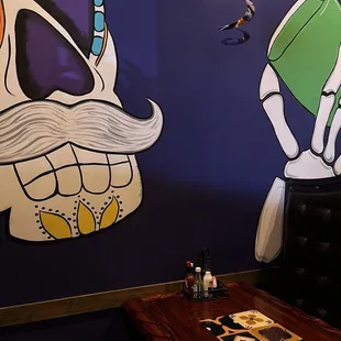 a mural of a man with a mustache and a moustache