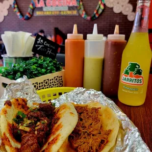 two tacos on tin foil