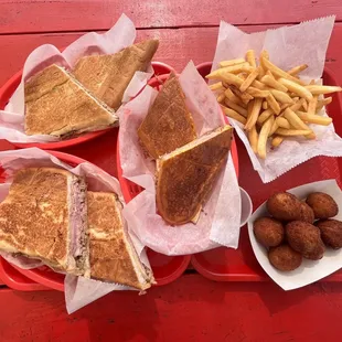 Cuban Sandwich, Papa Fritas Mini Papas Rellenas, Pan con Lechon Sandwich, and Media Noche Sandwich. Delicioso!