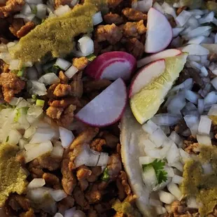 3 al pastor tacos, 1 asada taco.