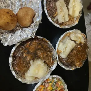 Ribs Stew - Costillas de Res Guisadas, Garden Salad, Chicken Stew- Pollo Guisado and corn beef.