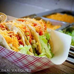 a taco with lettuce and cheese