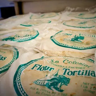 tortillas wrapped in plastic wrap