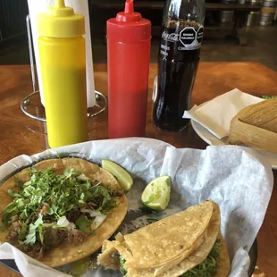 Two tacos, tamale and coke
