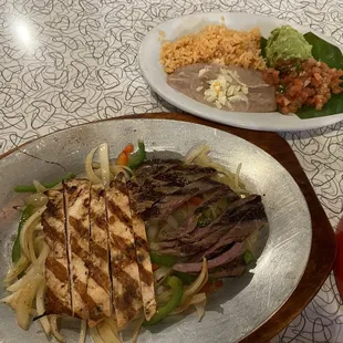 Combo (chicken, beef) fajita. Comes with tortilla, beans, rice, etc.