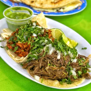 a plate of pulled pork tacos